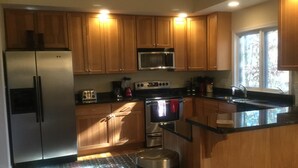 Coffee/tea maker, fridge, microwave, oven