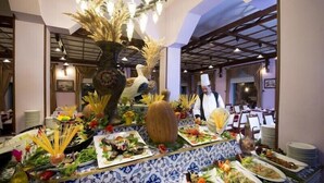 A buffet setup with various dishes and decorative elements. - Hotel Camkar (Sarikamis)