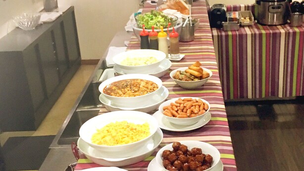 A buffet table with various dishes and condiments. - Koga Ark Hotel (Koga)
