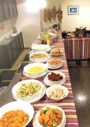 A buffet table with various dishes and condiments. - Koga Ark Hotel (Koga)