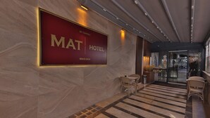 A hotel lobby with a large sign reading "MAT HOTEL" and a modern interior design. - BUCA MAT HOTEL BY TAHTALI (Izmir)