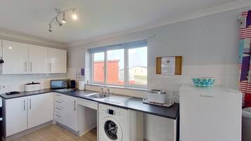 Fridge, microwave, oven, dining tables