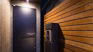 A modern elevator with a digital control panel and a door labeled "VillaFront Kyoto." - Villa Front Kyoto Seimei (Kyoto)
