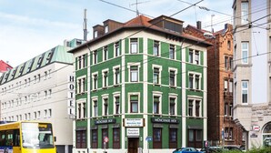A green and white building with "Bavaria Hotel" signage, indicating a hotel. - Bavaria Hotel Superior (Stuttgart)