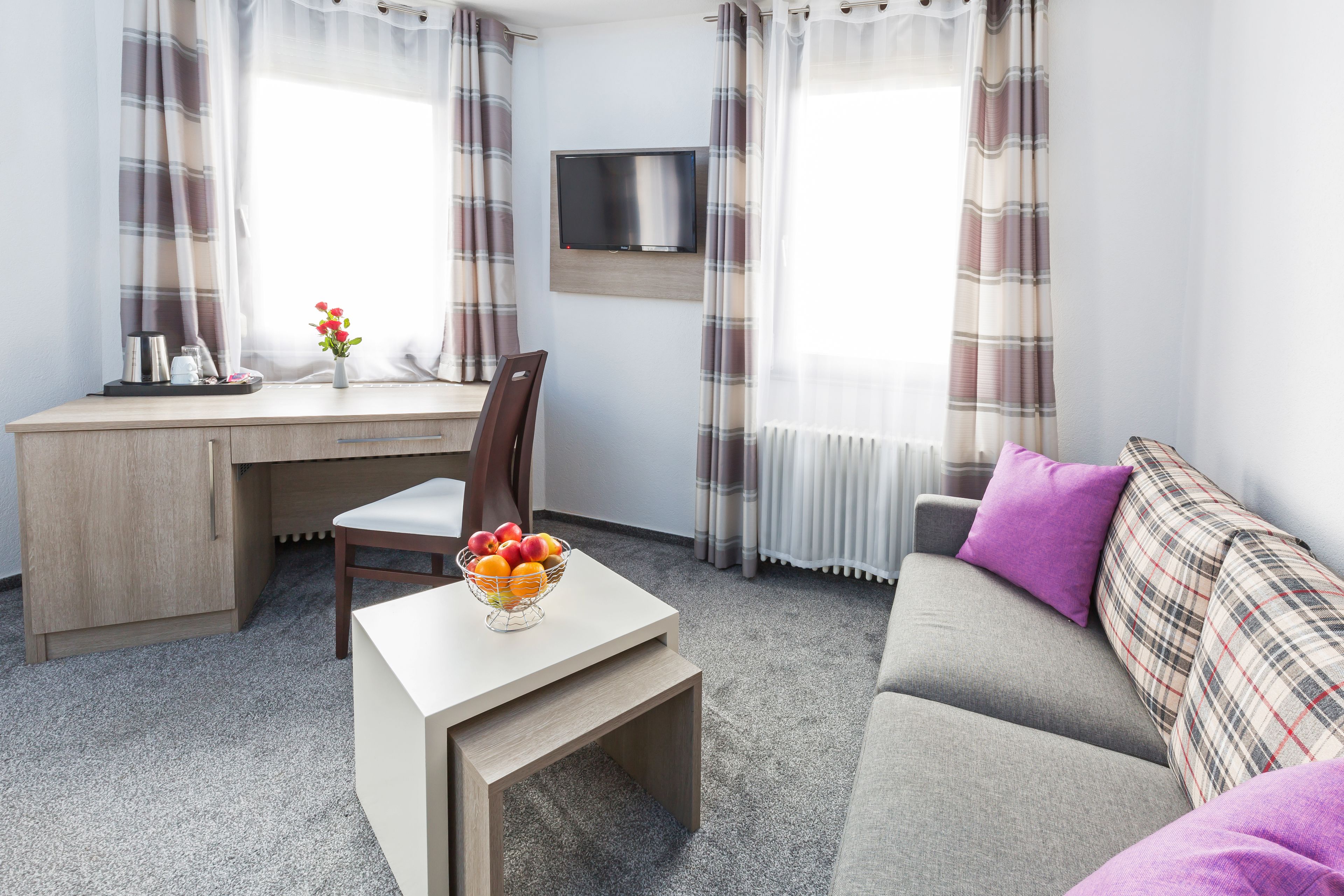 superior triple room | living area | flat-screen tv