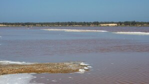 A wide river with calm water and a distant shoreline.