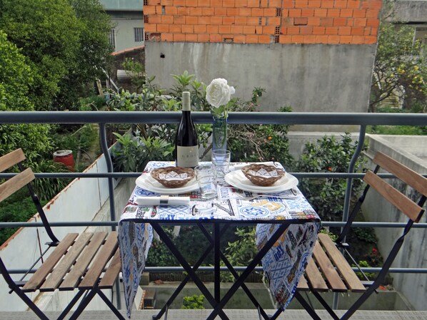 Enjoy a romantic dinner on the balcony overlooking the serene garden.