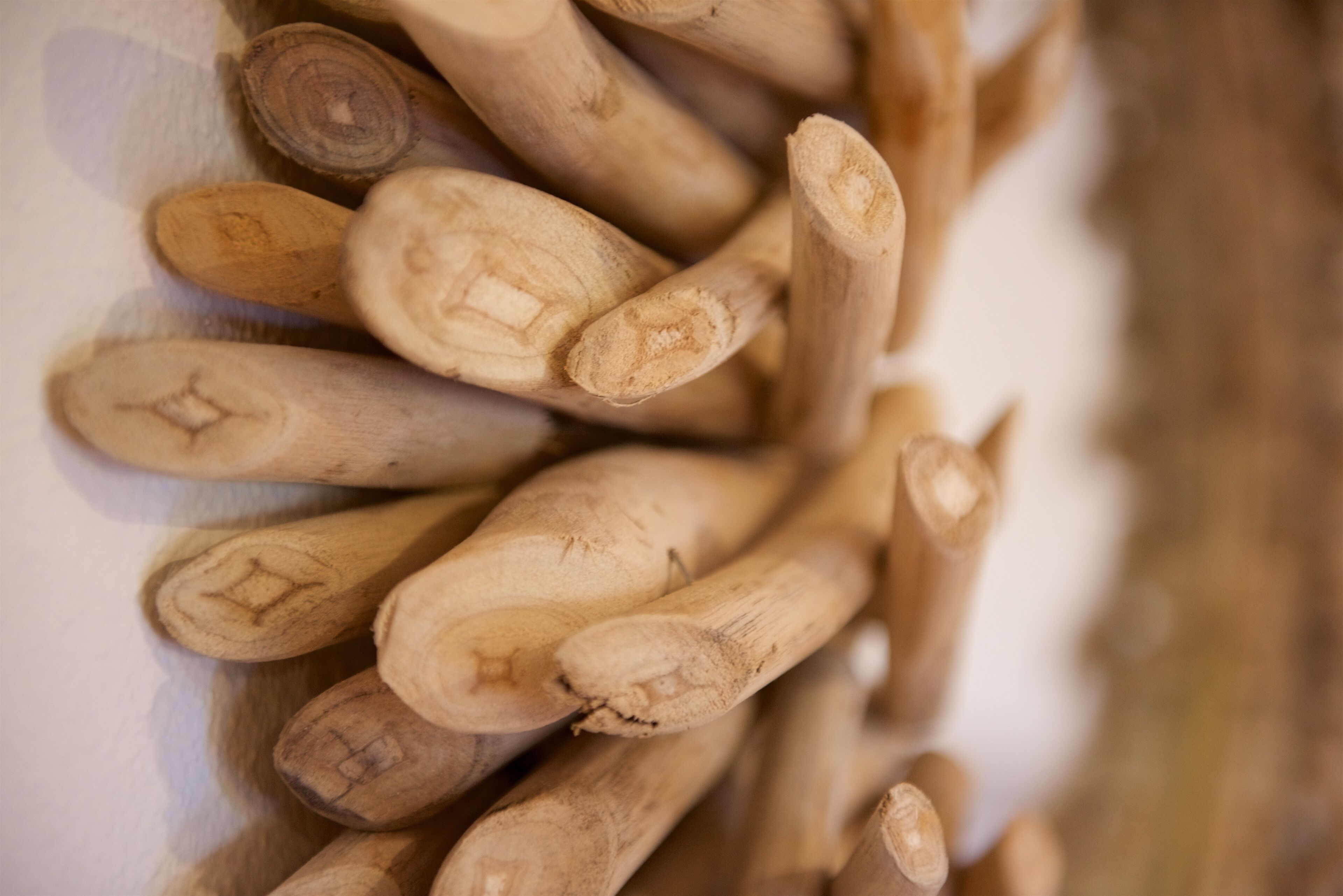 A collection of wooden objects with carved patterns.