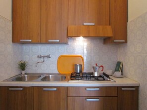 Fridge, microwave, stovetop, cookware/dishes/utensils