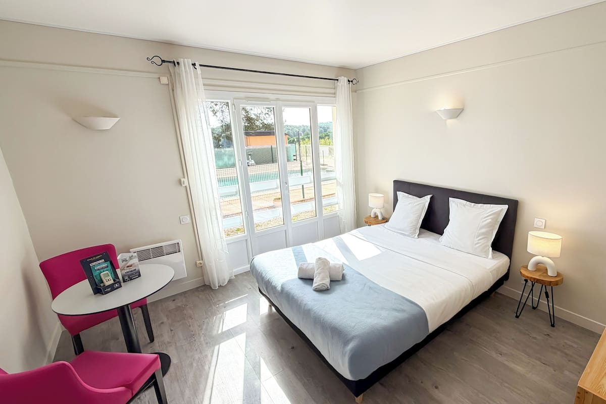 Individually furnished, desk, laptop workspace, iron/ironing board