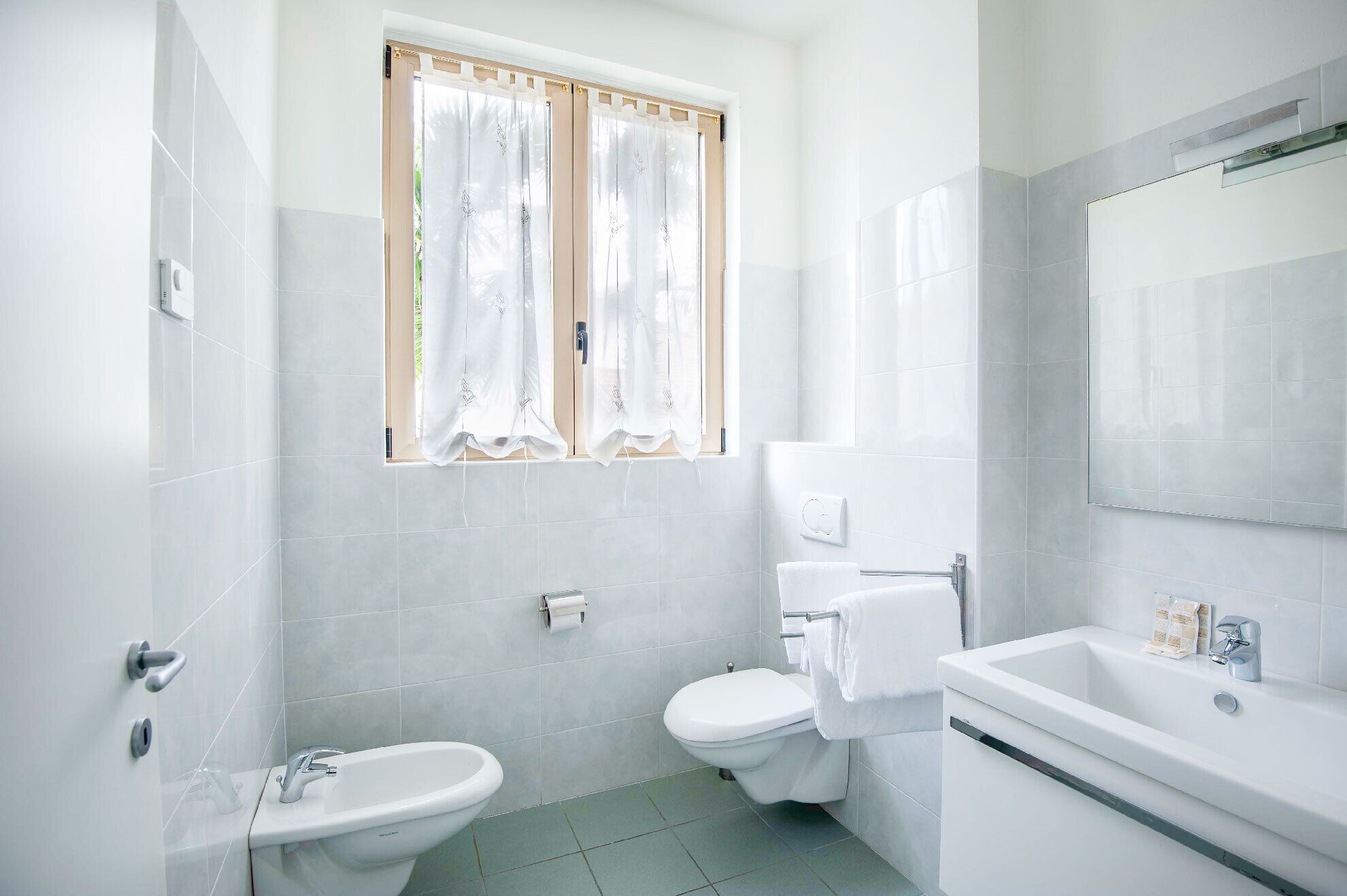 deluxe quadruple room | bathroom | shower, free toiletries, hair dryer, bidet