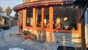 A traditional chalet with a stone foundation, wooden exterior, and a curved roof. - Zbójna Debra (Lubomierz)