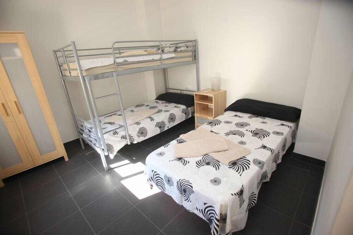 Triple Room, Shared Bathroom | Blackout curtains, free WiFi