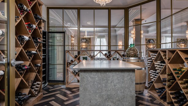 A wine cellar with wooden racks and a marble counter. - Söderköpings Brunn (Soderkoping)