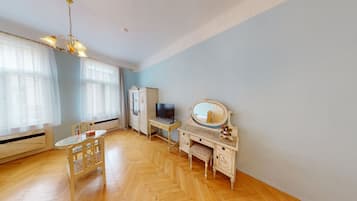 Enjoy a quiet and practical space with a large window, comfortable seating, and a convenient wardrobe.