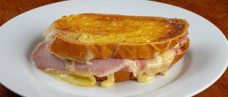 A sandwich on a white plate.