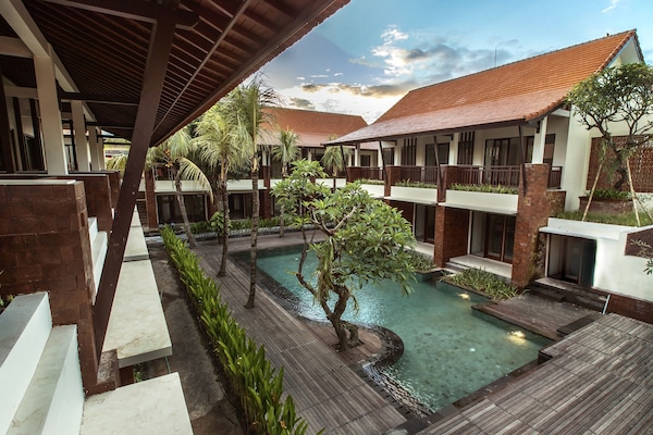 Outdoor pool, open 7:30 AM to 8:00 PM, pool loungers