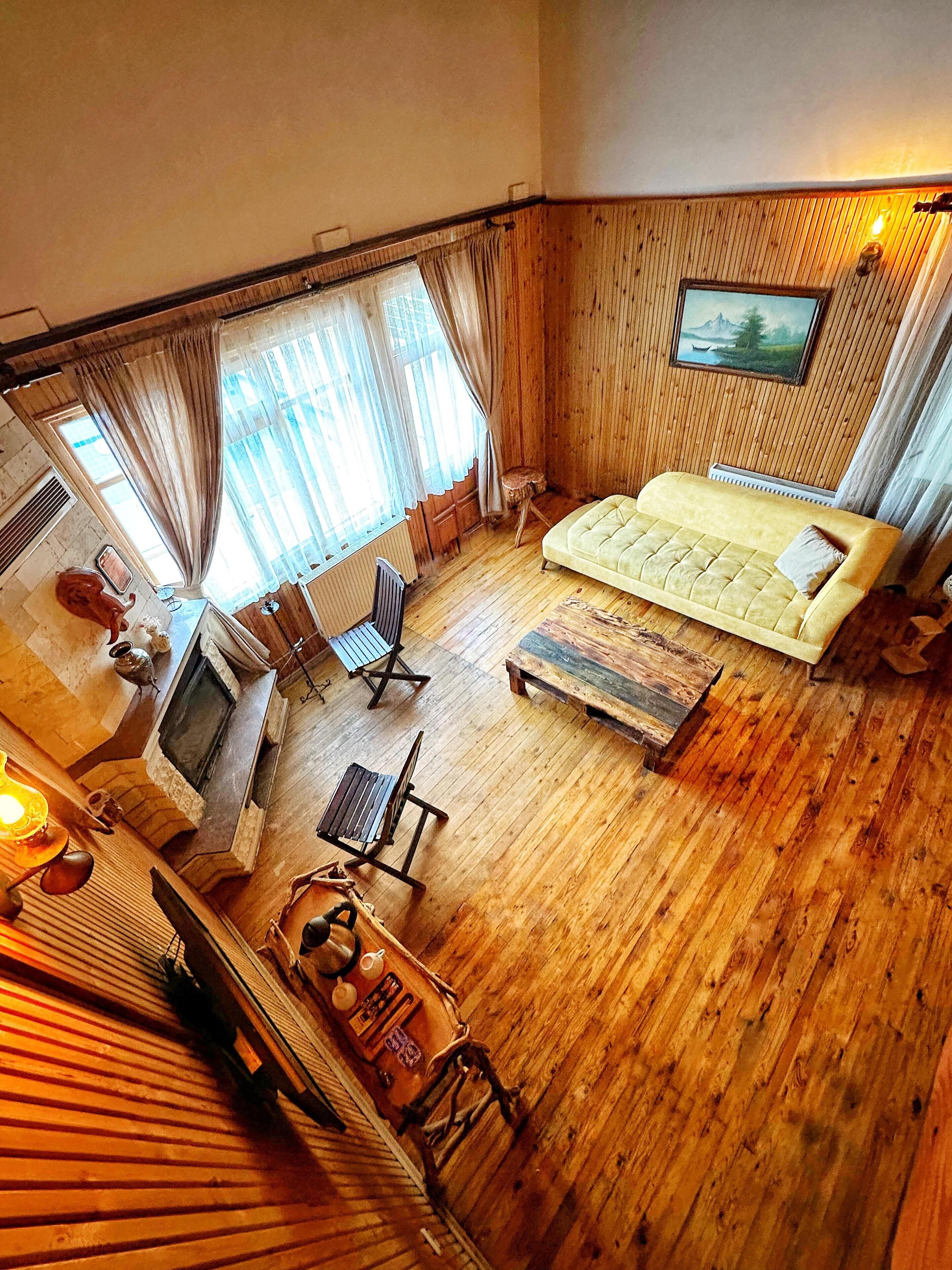 luxury suite, 2 bedrooms, pool view, sea facing | living area | 43-inch smart tv with satellite channels, fireplace, heated floors