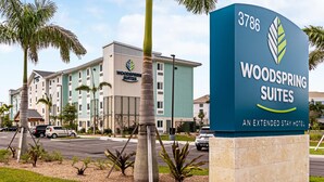 A hotel sign with the number 3786 and the name "Woodspring Suites" indicating an extended stay hotel. - WoodSpring Suites Naples East (Naples)