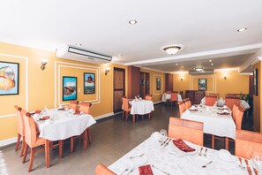 Breakfast, lunch, dinner served; local and international cuisine