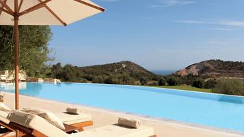 Seasonal outdoor pool, an infinity pool, sun loungers