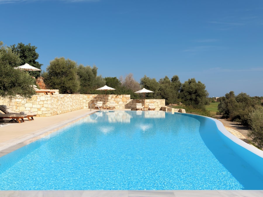 Seasonal outdoor pool, an infinity pool, pool loungers