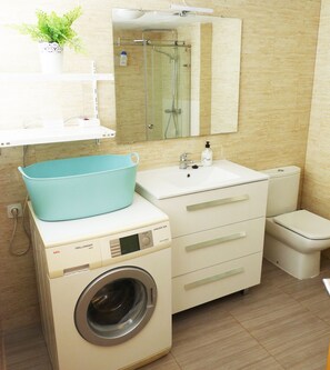 Shower, hair dryer, towels, soap