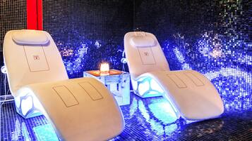 Relax in comfort with massage chairs and a tranquil ambiance.