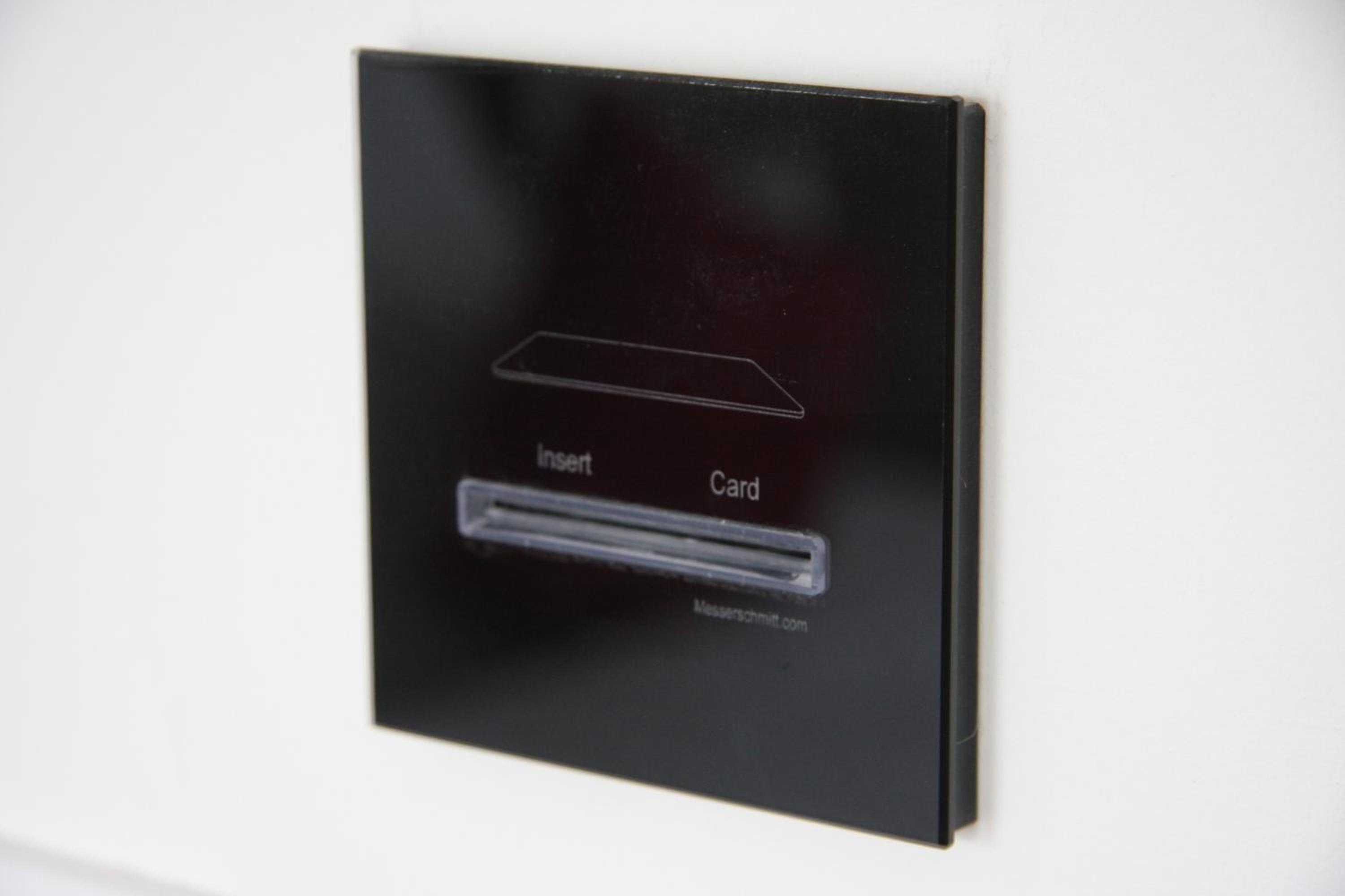 A black card reader with an insert slot and a card slot, labeled "Insert Card."