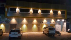 A building with multiple storefronts, including 'Angel Fashion' and 'Dream Vision Guest House'. - Dream Vision Guest House (Diu)