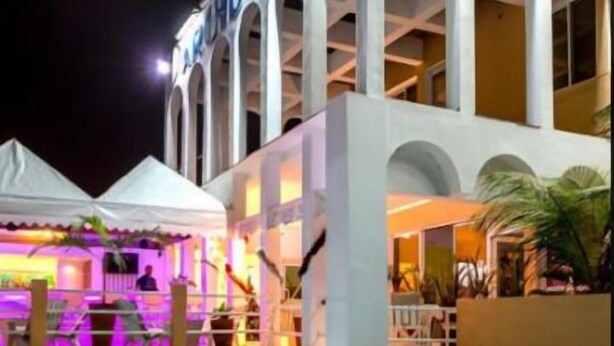 A hotel with a pool and a grill area. - Archotel (Dakar)