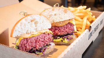 A box containing a burger and fries.