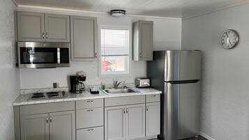 Fridge, microwave, stovetop, coffee/tea maker