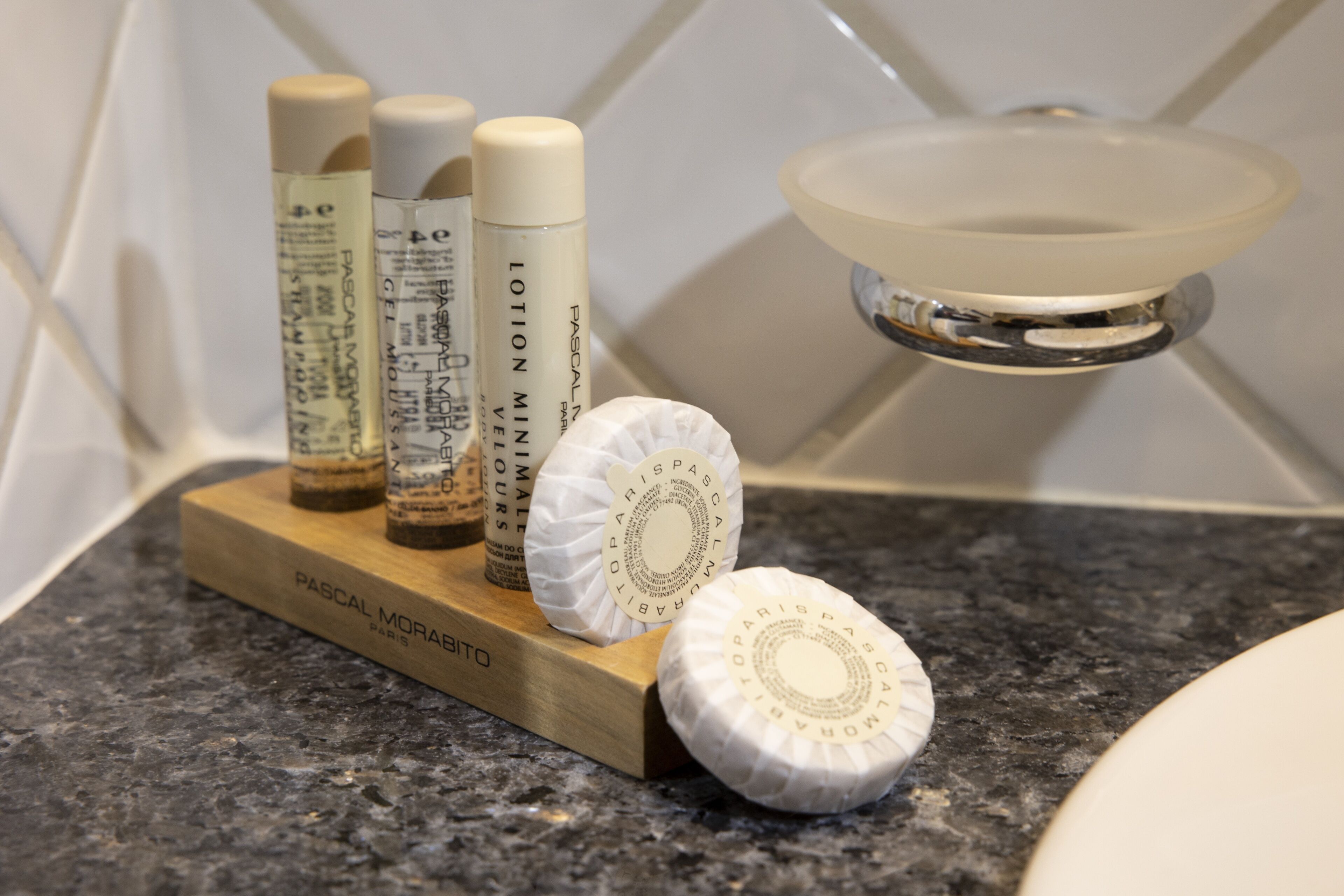 designer toiletries, hair dryer, bathrobes, slippers