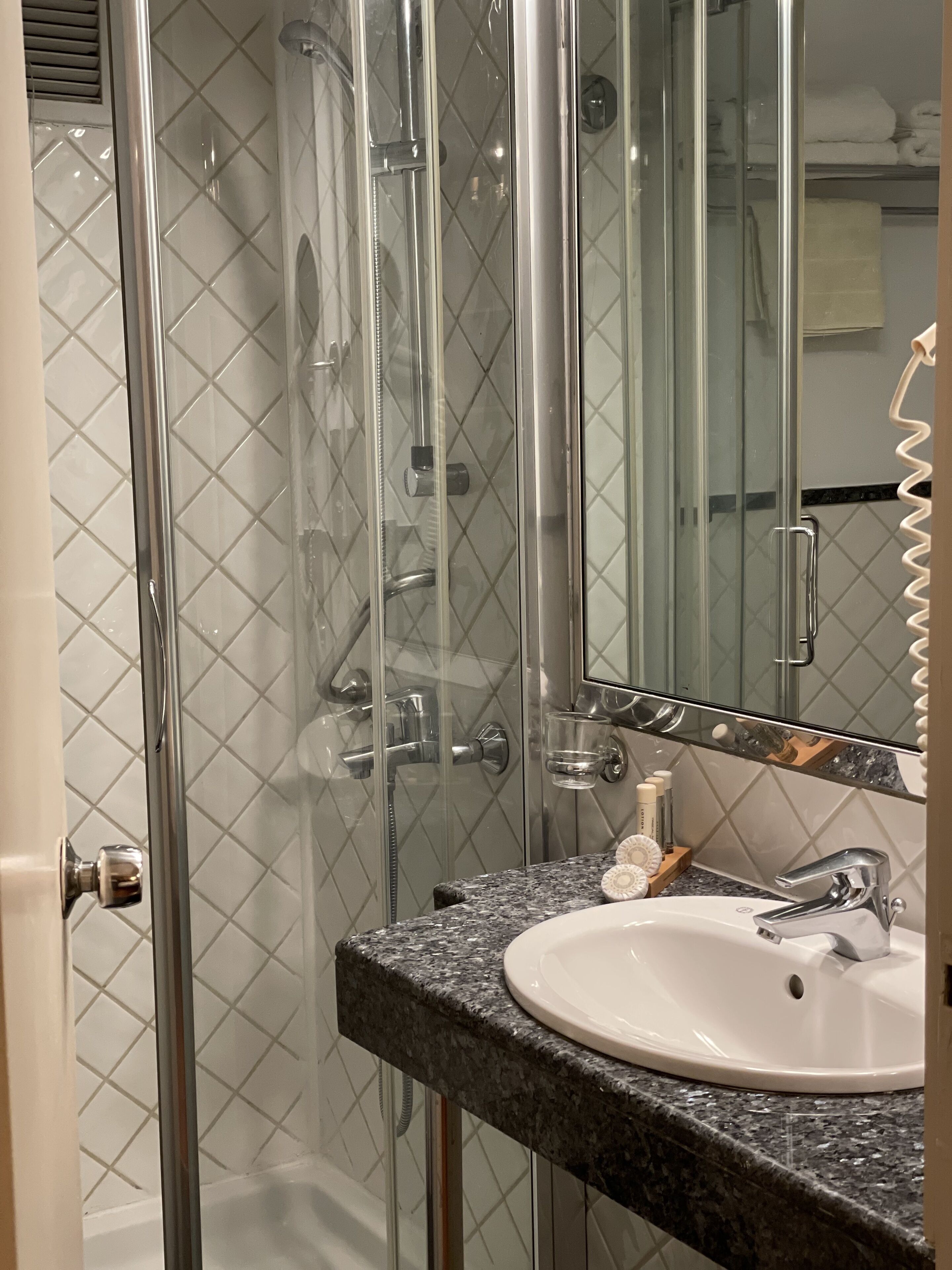 designer toiletries, hair dryer, bathrobes, slippers