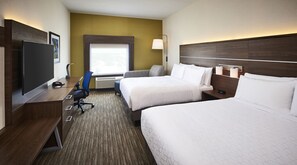 A hotel room with two beds, a desk with a flat-screen TV, a chair, a lamp, and a window with a view. - Holiday Inn Express and Suites Brantford by IHG (Brantford)