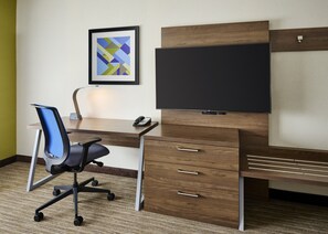 A modern office desk with a flat-screen monitor, a telephone, and a framed abstract artwork on the wall. - Holiday Inn Express and Suites Brantford by IHG (Brantford)