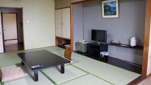 A room with tatami flooring, a television, a telephone, and a coffee maker. - Ohamaso (Toba)