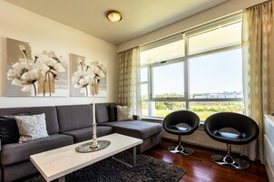 Luxury Apartment, 1 Bedroom, River View, Oceanfront | Living area | Flat-screen TV, pay movies
