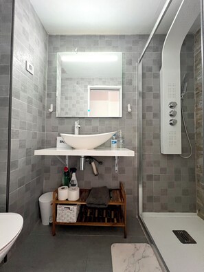 Shower, hair dryer, towels, soap