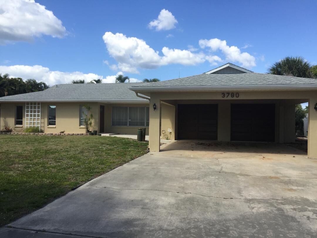 A single-story house with a garage, a number 3780 on the garage door, and a well-maintained lawn.