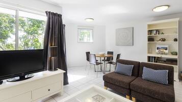 Unit 10B 1 BEDROOM | Living area | Flat-screen TV, streaming services