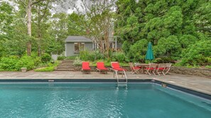 A heated pool, sun loungers