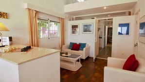 A modern living room with a chessboard, a sofa, a coffee table, and a dining area. - Modern Villa with pool and garden Finca La Xara (Pedreguer)