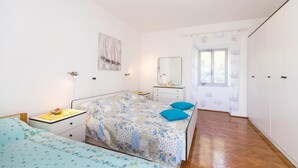 A bedroom with a bed, bedside table, dresser, mirror, and wardrobe. - 1 bedroom lovely home in Zagorje (Zagorje)