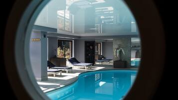 Indoor pool, open 10:00 AM to 8:00 PM, pool loungers
