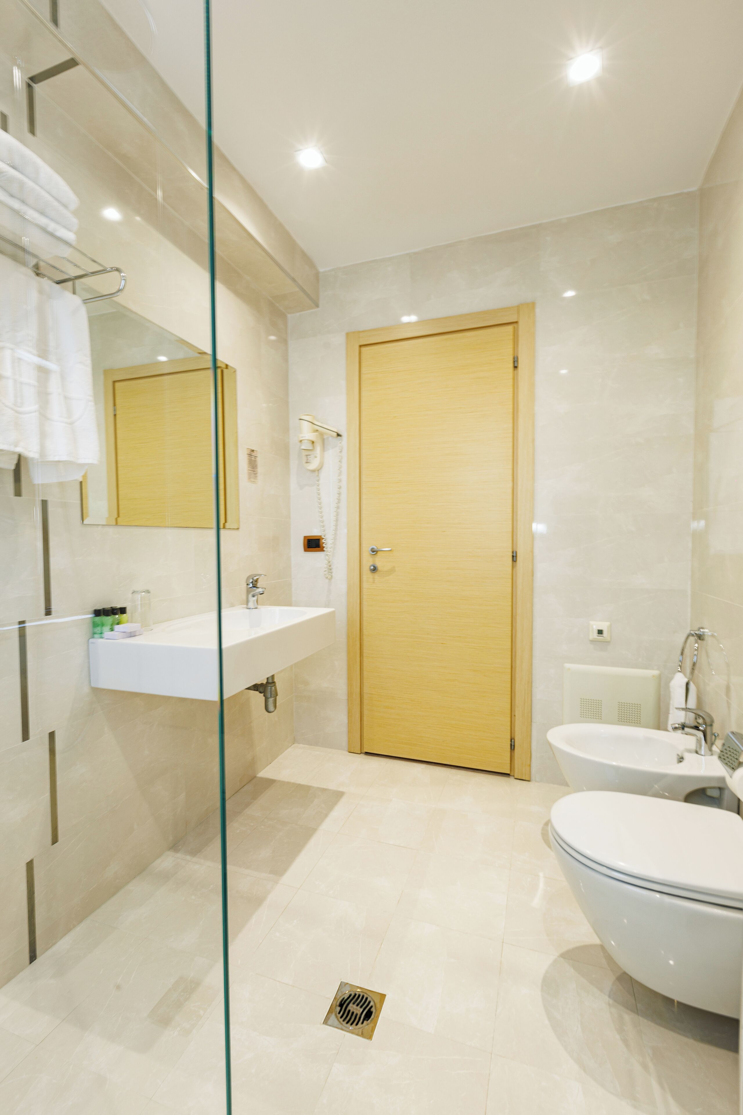 shower, hair dryer, bathrobes, slippers