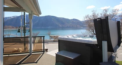 Lakeview home with wrap-around deck, easy lake access, private hot tub, & more