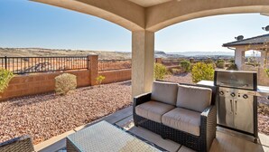 A covered patio with a view of a desert landscape, a grill, and a seating area. - The Florentine - Pool! Hot Tub! (Washington)