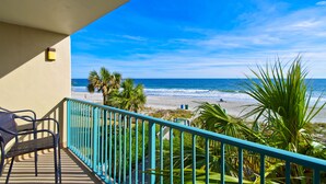 A balcony with a view of the beach and ocean. - Oceanfront Condo on The Golden Mile in Myrtle Beach (Myrtle Beach)